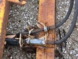 a close up of a rusted piece of equipment on the ground