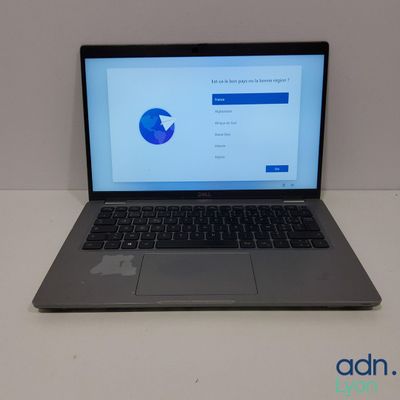 an open laptop computer sitting on top of a white table