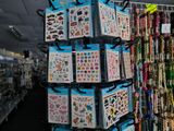 a display of stickers on a rack in a store
