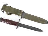 an image of a knife with a sheath and sheath on a white background