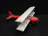 a toy airplane that is sitting on a black surface