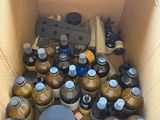a cardboard box filled with bottles of beer and a bottle opener
