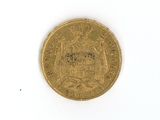 a gold coin on a white surface with a picture of a coat of arms on it