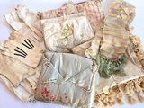 many different types of clothing on a white surface