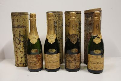 six bottles of champagne are lined up in a row