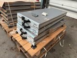 several stacks of steel plates stacked on top of each other