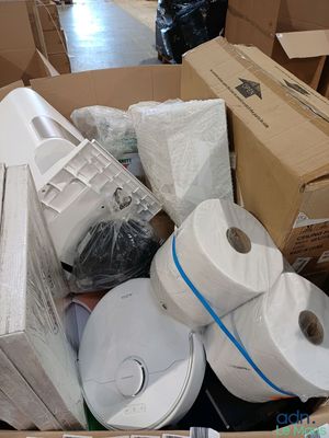 many rolls of toilet paper in a box on the floor