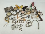 a lot of assorted watches and other items on the table