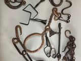 a lot of old metal tools on a white surface