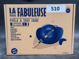 packaging of a blue frying pan with a wooden spatula in it