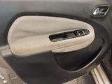 the door panel of a car with a remote control in it