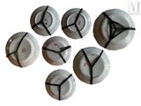 six white plates with black numbers on them sitting on top of each other