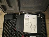 a black case with wires in it on a tiled floor