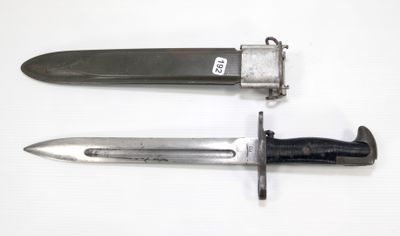 two different types of knives on a white surface