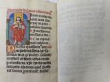 an open book with a picture of jesus on it