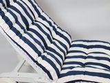 a blue and white striped chaise lounger with wheels