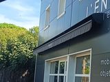 une enseigne apposée sur le côté d'un immeuble sur laquelle on peut lire « Enders Enterprises »