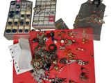 a red table with a bunch of jewelry on it