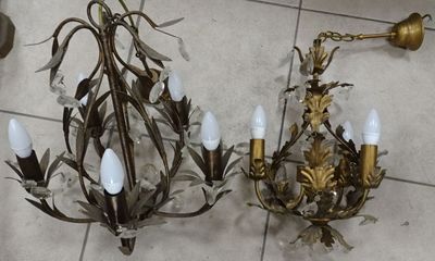 two chandeliers that are on the floor next to each other