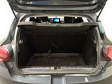 the back of a car with its trunk open and a tv in the trunk