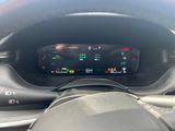 the dashboard of a car with a digital display in the center