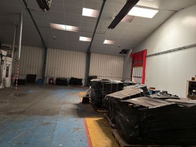 a large warehouse with a lot of boxes on the floor