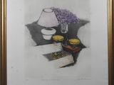 painting of a table with a lamp and a plate of food on it
