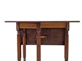 a wooden table with two legs and a table top on it