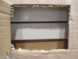 a picture of a cardboard box with a hole in it