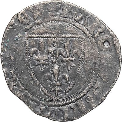 a silver coin with an image of a lion on it