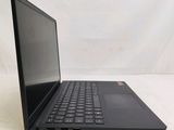 the back of a laptop computer sitting on top of a white surface