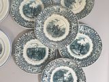 a lot of plates that are on the wall