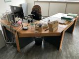 a desk with a computer and a monitor on it