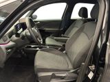 the interior of a car with the door open showing the driver ' s seat