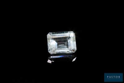 an emerald cut diamond on a black background