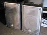 two speakers sitting next to each other on a table
