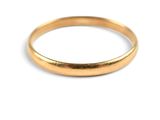 a close up of a gold ring on a white background