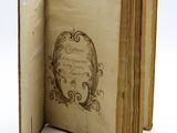 an old book with a picture of a woman in a frame on it