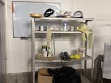 a room with a bunch of items on a shelf