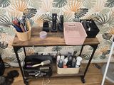 an image of a desk with a lot of makeup items on it