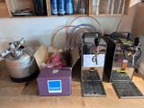 many different types of coffee machines on the counter