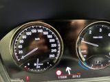 a close up of a car dashboard with gauges and speedometers