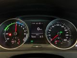 a close up of a car dashboard with various gauges