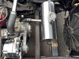 a car engine with a fan and a radiator in it