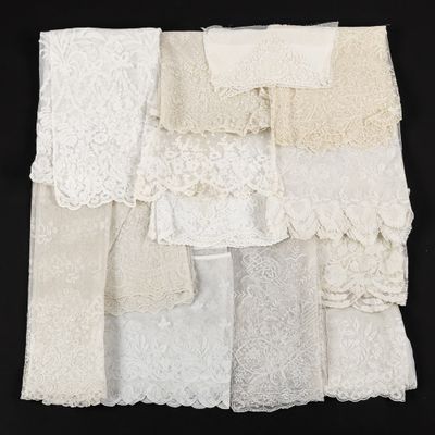 a close up of a bunch of white lace on a black surface