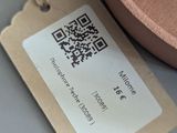 a brown hat and a tag on a table