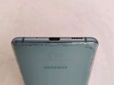 the back of a blue samsung galaxy s9 with the camera facing up