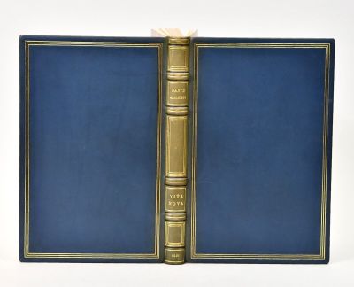 a blue book with gold trim and a golden book cover