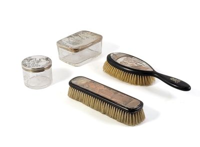 three brushes, a brush, and a glass jar on a white surface
