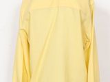 a mannequin mannequin wearing a yellow shirt on a mannequin mannequin mannequin mannequin mannequin mannequin mann